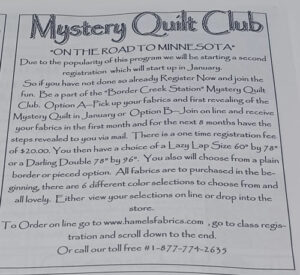 Announcement written in Papyrus font about the Mystery Quilt Club On The Road To Minnesota Quilt